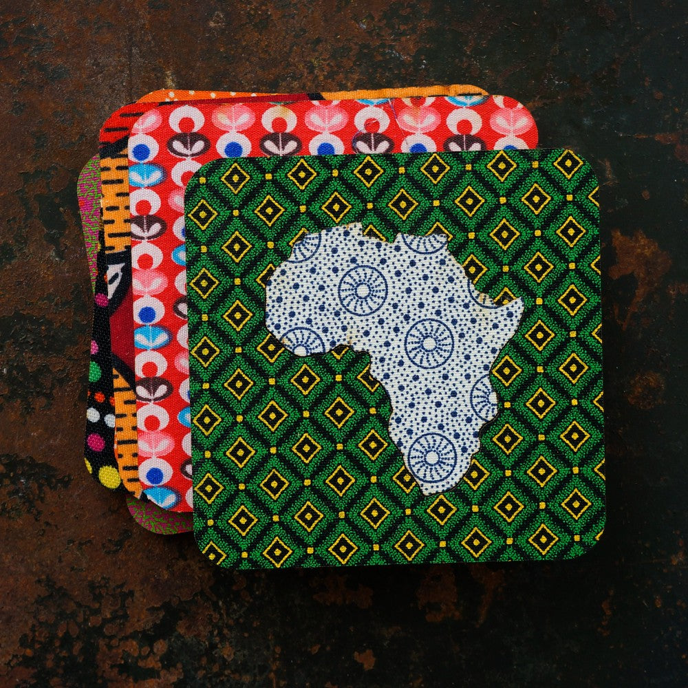Stack of colorful patterned coasters on a dark surface