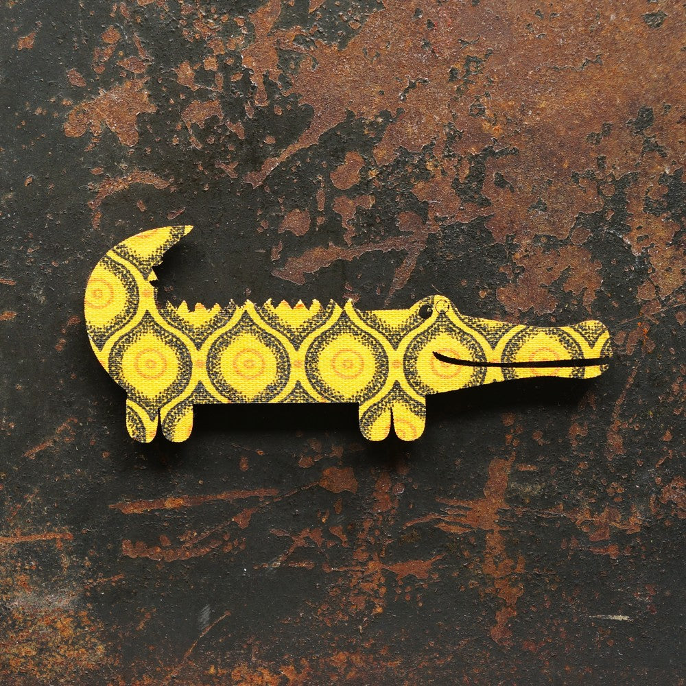 Crocodile magnet covered with vibrant South African Shweshwe fabric.