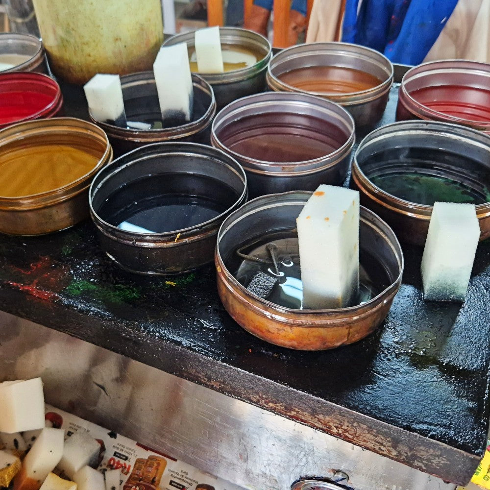 Background colours are sponged on in bands.