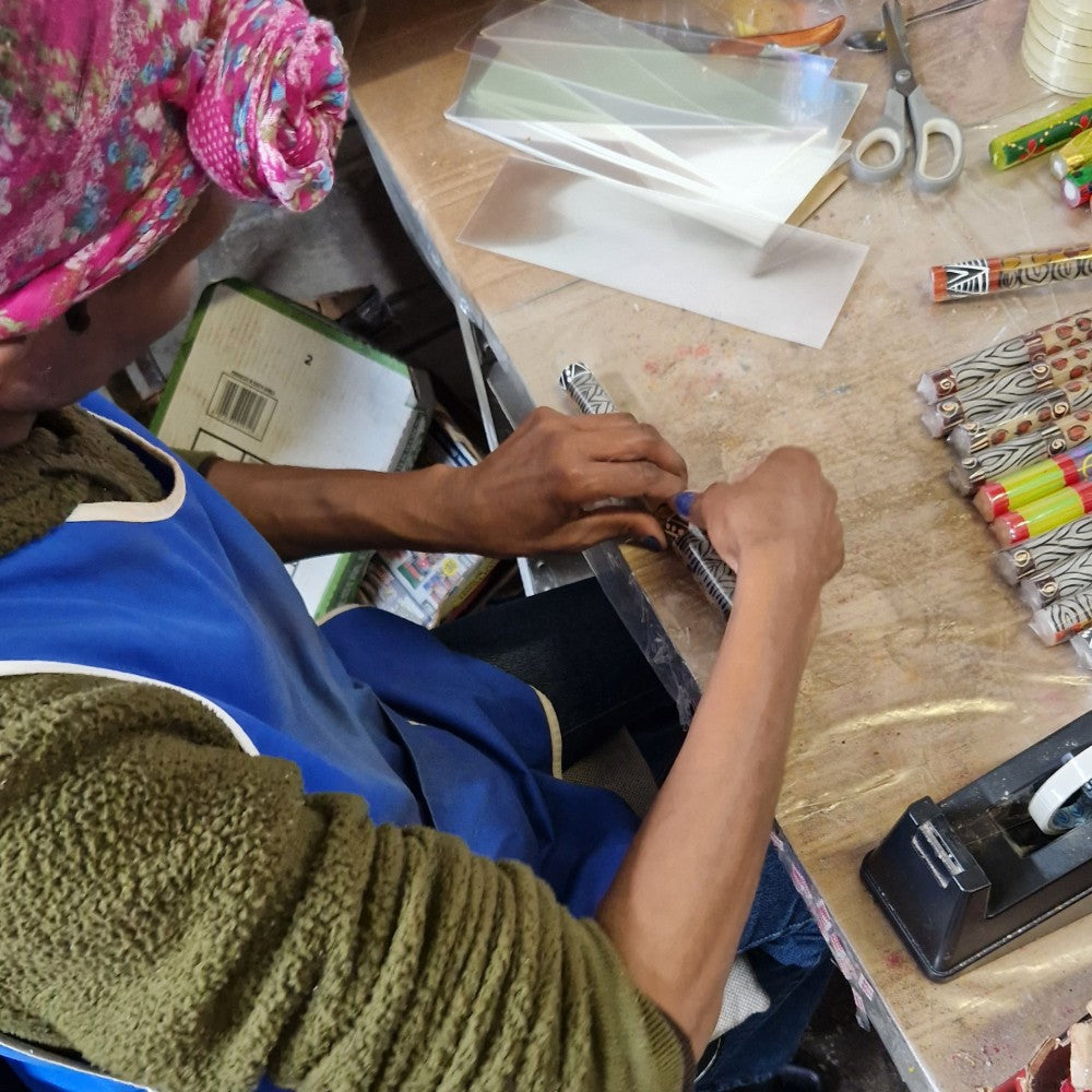 Candles are carefully wrapped to protect their delicate patterns